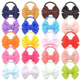 20 stuks / partij baby kleurrijke mini solid haar bogen schattige baby boog pasgeboren decoratie elastische haarband kinderen haaraccessoires AA220323