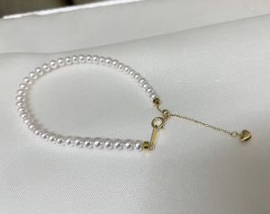22090808 Joyería de mujer pulsera de perlas brazalete de cadena de agua dulce au750 yellpw oro colgante clásico ajustable en forma de corazón