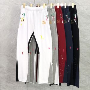 22ss Otoño Invierno Europa Splash Ink Patchwork Pantalones Pantalones con estampado dorado Pantalones acampanados Casual Cordón Pantalones de chándal Hombres Mujeres Jogger Slim Fit