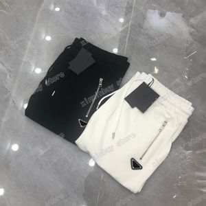 22ss Hombres Mujeres Pantalones de diseñador Metal Triángulo Etiqueta Cremallera Bolsillo Nylon Pantalón Hombres Correas Pantalones Negro Blanco Xinxinbuy S-XL299C