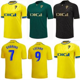 23 24 Maillots de football Cadix CADIZ CF 2023 2024 LOZANO ALEX Bodiger Juan Cala CAMISETA ASCENSO A LIGA SANTANDER de Carnaval domicile 3ème maillots de football haut