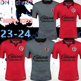 23 24 maillots de football Tijuana de Xolos Club MANOTAS Martinez Angulo Castillo ROSA 2023 2024 domicile noir maillots de football blancs