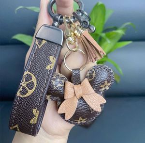 23 Diseñador Llavero Monedero Llavero Monedero Colgante Cadena de Coche Encanto Bolsa de Cubo Flor Mini Monedero Llaveros Bolsa Baratija Regalos Accesorios