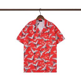 23SS Camisas de diseño de lujo para hombres Camisa de boliche geométrica de la moda de Hawai Floral Camisetas casuales hombres Slim Fit de manga corta M-3xl