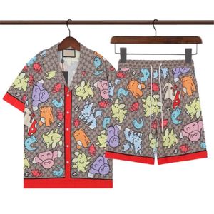 23SS Camisas de diseñador de verano para hombre Pantalones de playa Conjuntos Moda Floral Estampado de letras Camisa casual Hombres Slim Fit Manga corta Tablero Pantalones cortos de playa