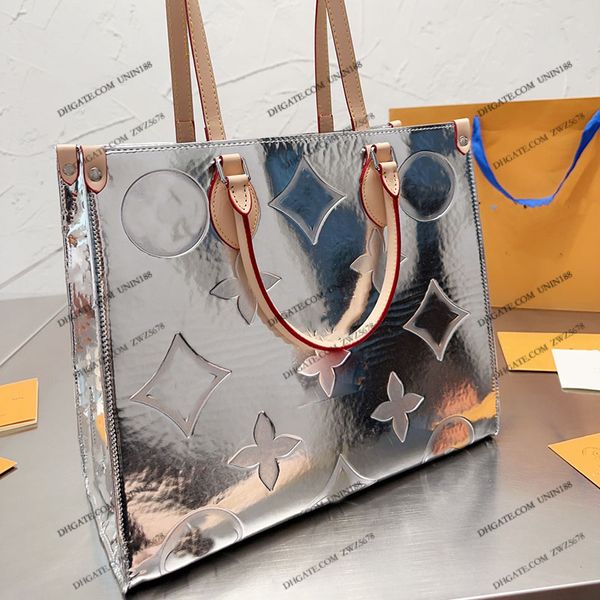 23SS Mujeres Luxurys diseñador Totas bolsas Onthgo Silver Leather Handbods Shouder Crossbody Ladies Flores Flores de hardware original Puga de 35 cm