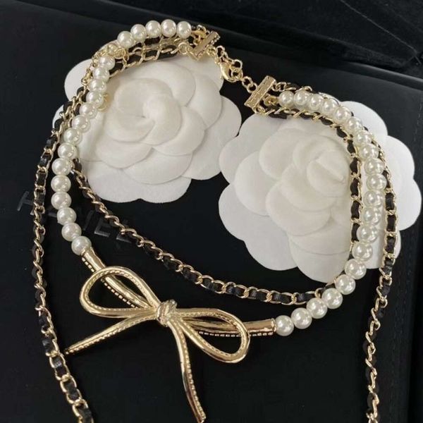 24SS Designer Channel Xiangjia 23 Été Nouvelle chaîne de perle empilée portant du cuir de vent portant un long nœud en mousque
