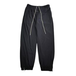 24SS Fashion USA Men Label de silicona pequeña pantalones de nylon de gran tamaño transpirable cómodo pantalones de joggadores con cordero