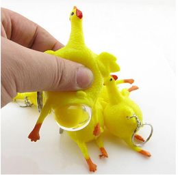 新しい面白いエキゾチックなおもちゃチキン敷設卵のキーホルダーのおもちゃの絞りチキン反応救済ベントトリッキーなおもちゃ