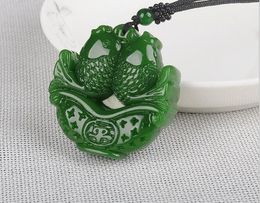 Green jade spinach-like pendant and Tianyu white jade fish pendant