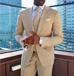 beige jacket blue trousers