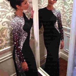 2020 New Bling Crystal Beaded Black Long Sleeve Sheath Evening Dresses Jewel Neck Sweep Train Muslim Prom Gowns Arabic Sparkly Rhinestones