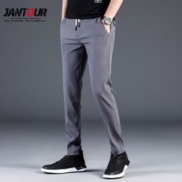 Calças de verão masculinas skinny elásticas coreanas calças casuais slim fit chino cintura elástica jogger vestido masculino à prova d'água fino
