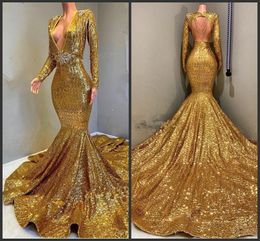 2019 New Gold Sparkling Long Sleeves Sequins Mermaid Prom Dresses Deep V Neck Beaded Stones Backless Sweep Train Party Evening Gowns