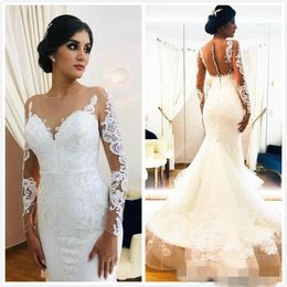 2020 Elegant Mermaid Dresses Long Illusion Sleeves Sexy Sheer Neck Covered Buttons Lace Applique Chapel Train Tulle Wedding Gown