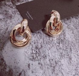 -Manera- simple y el anillo de oro de moda escalonados diseñar pendientes de la forma geométrica de las mujeres pendientes de la joyería del envío