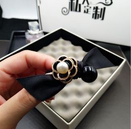 Fashion-Korea simple black and white camellia hair rope bow fabric hair ring head rope pearl ball head tie rib rubber band