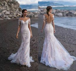 Modest Bohemian Mermaid Wedding Dresses Jewel Neck Long Sleeve Tulle Lace Applique Wedding Gowns Sweep Train robe de mariée