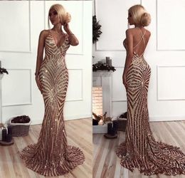 2020 Sparkly African Prom Dresses Mermaid Sequins Deep V Neck Spaghetti Straps Criss Cross Backless Sweep Train Sweet 16 Party Evening Gowns