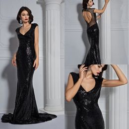 2020 Glamorous Black Mermaid Evening Dresses Capped V Neck Hollow Sequins Tulle Prom Dress Sweep Train Formal Dresses