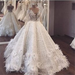 Luxury Feathers Major Beading Wedding Dresses Sheer Neck Long Sleeves Beaded Saudi Arabic Dubai vestido de noiva Bridal Dress