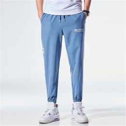 Loose Casual Man Harem Pants Fashion New Hot Sell Drawstring Pencil Cropped Pants Straight Leggings Male Pocket Trousers Clothing