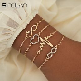 Sindlan 4PCs Crystal Heart Infinity Bracelets for Women Gold Heart Beat Charm Wrist Chain Bracelets Set Fashion Hand Jewellery