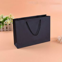 custom design slogan black craft paper bag with your own logo printing