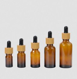 30pcs 5 10 15ml 30ml 50ml clear Amber Glass Dropper Bottles with Bamboo Cap 1oz Bamboos Essential Oil Bottle