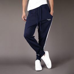 Fashion- Sports pants men's casual Sweatshirt slim binding feet side ribbon printing sports running loose Capris hot sale