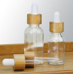 5 10 15ml 30ml 50ml clear glass bottles custom logo dropper essential oil bottle with bamboo cap e liquid