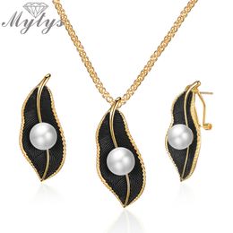 Mytys Pearls Necklace On Black Leaf Jewelry Sets For Women Retro Romantic Gold Wire Frames Leaf Pendant Earrings CE611CN5402329