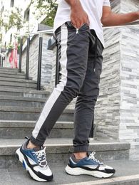Мужские брюки Мужчины Брюки спортивные тонкие хип-хоп напечатанные щипы напечатанные бегуны уличные спортивные штаны Harem брюки комбинезон европейских американцев