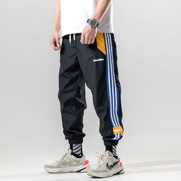 BINHIIRO Men Cargo Pants Casual Cotton Polyester Patchwork Pattern Men Full Length Drawstring Pockets Black Orange Men Trousers 201110