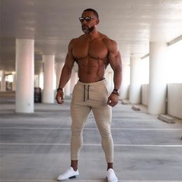 autumn new Men Fitness Sweatpants male gyms Bodybuilding workout cotton trousers Casual Joggers sportswear Pencil pants LJ201104