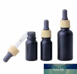 Top Selling 10ml 30ml matte black essential oil serum glass dropper bottles for Cosmetic packaging with plastic bamboo cap tube