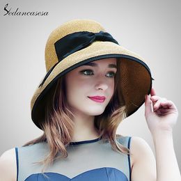 New Summer Wide Brim Beach Women Sun Straw Hat Elegant Cap for Women UV Protection Black Bow Straw Hats Girls Hot SW129001 Y200602