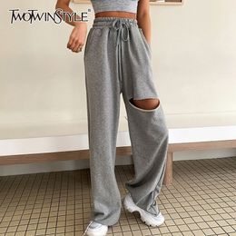 TWOTWINSTYLE Casual Asymmetrical Women Full Length Pants High Waist Lace Up Bow Ripped Hole Wide Leg Pant For Female Clothes New 201031
