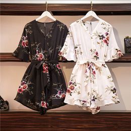 Women Sexy Flare Sleeve Floral Print Rompers Summer V-Neck Belt Beach Short Jumpsuit Casual Female Loose Plus Size Romper L-4XL T200704