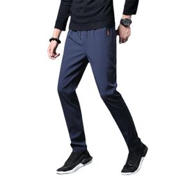 Pantaloni da uomo di grandi dimensioni 4XL Pantaloni casual Pantaloni da pista sottili da uomo Pantaloni elasticizzati a gamba dritta rapida Pantaloni sportivi da jogging Pantaloni maschili