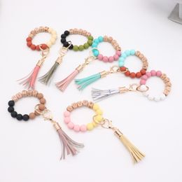 Wholesale foreign trade food grade silicone beads wrist keychain alloy cap PU leather tassel keychain female multicolor optional