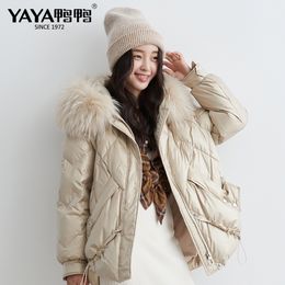 YAYA Winter Warm Big Pocket 90% White Duck Down Jacket with Irregular Hem Women Real Fur Collar Hooded Thicken Gold Black Coat 201019