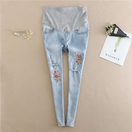 Embroidery Flower Denim Maternity Jeans Summer Light Blue Ripped Hole Pencil Pregnancy Trousers Clothes for Pregnant Women LJ201114