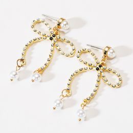 Fashion temperament acrylic diamond-studded bow-knot pearl earrings female personality simple girl heart ear nail