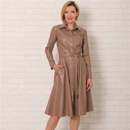 Winter Casual Sashes Pu Leather A-Line Dresses Women Turn-down Collar Long Sleeve Solid Colour Knee Dress Office Lady Wear 201029