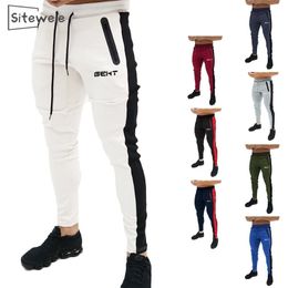 SITEWEIE Men's High Quality Pants Fitness Elastic Pants Bodybuilding Clothing Casual Camouflage Sweatpants Joggers Pants L246 201125