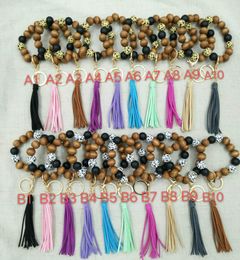 Cross-border creative handmade beaded wooden bead bracelet keychain fashion Korean version of velvet multicolor tassel pendant