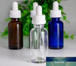 Wholesale Childproof Blue Green Clear Amber Glass Liquid Bottles 30ml Glass Perfume Essential Oil E Juice Bottles With Black Cap