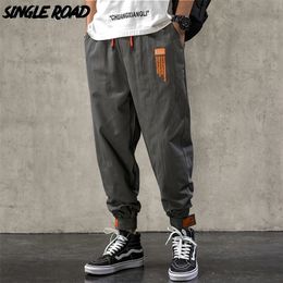 Pantaloni Harem da uomo a strada singola Moda uomo Pantaloni larghi in cotone Hip Hop Pantaloni streetwear giapponesi Pantaloni cargo maschili per uomo 220311