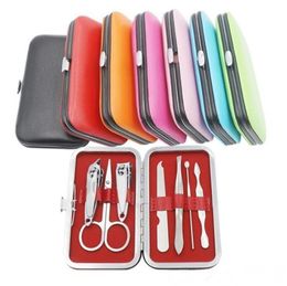 Hot 7 pcs Nail Clippers Kit Scissors Tweezer Knife Ear pick Utility Manicure Set Tools Random Colors DHL Free Shipping